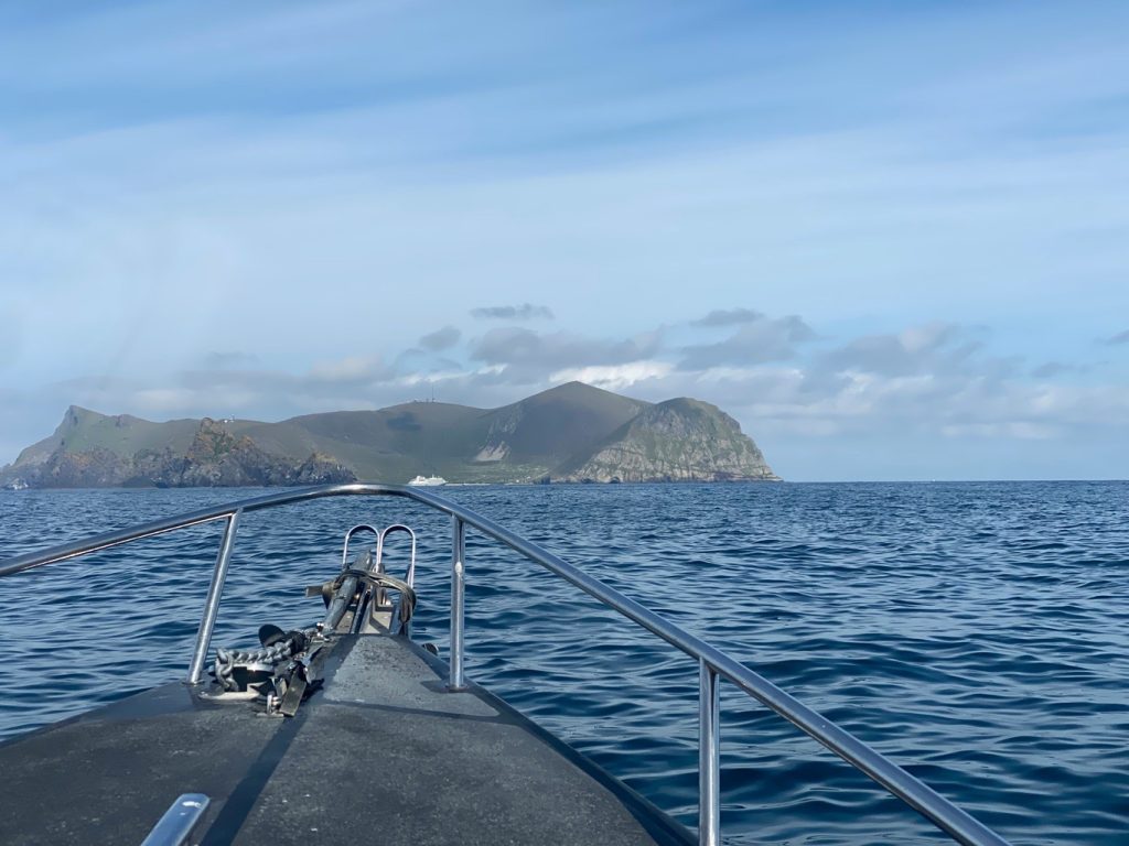Hirta appearing on the horizon arriving by boat to St Kilda, Outer Hebrides, Scotland